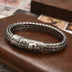 Men's Sterling Silver Crowned Skull Clasp Braided Bracelet
